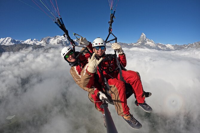 20 to 25 Minute Tandem Paragliding in Zermatt and Matterhorn View - The landing and the victory drink