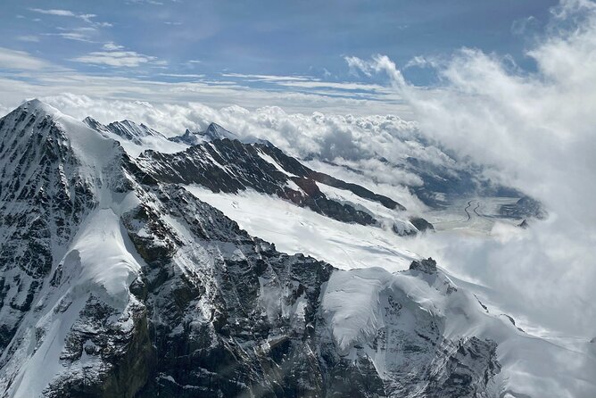 Private Swiss Alps helicopter tour over snow covered mountain peaks and glaciers - Interlaken between two very different lakes
