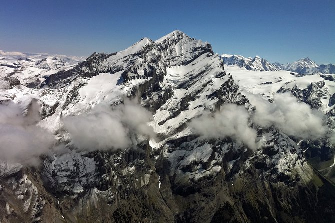 Private Swiss Alps helicopter tour over snow covered mountain peaks and glaciers - Lake Thun and Lake Brienz by helicopter