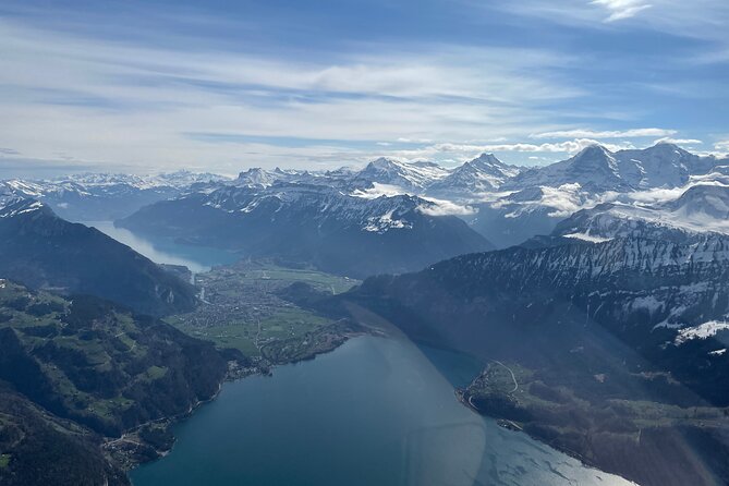 Private Swiss Alps helicopter tour over snow covered mountain peaks and glaciers - The private cabin and pilot commentary