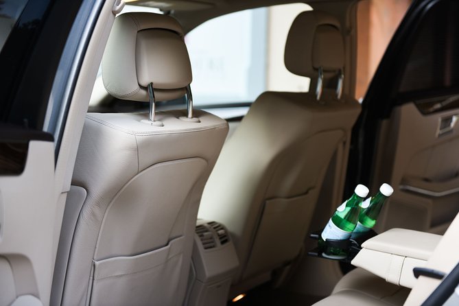 Private transfer from Zurich City to Zurich Airport - WiFi, water, and flight monitoring on the way