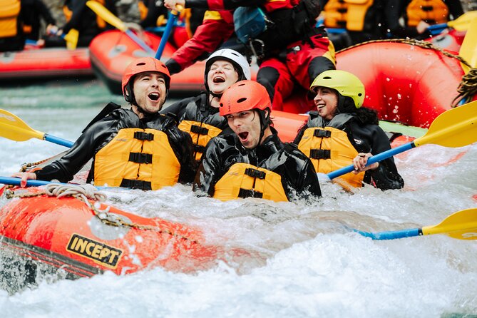 Whitewater Action Rafting Experience in Engadin - Practicing commands on the quieter river